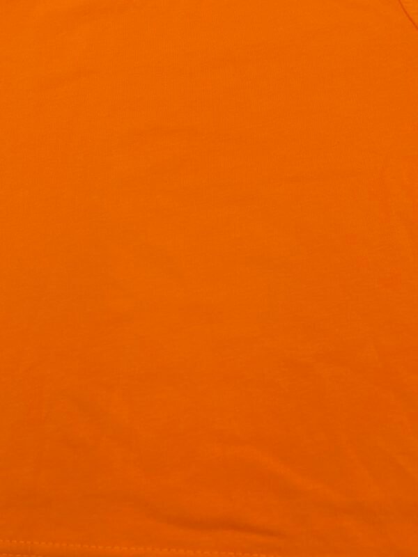 Polera unisex de algodón infantil color naranjo en Fluxi